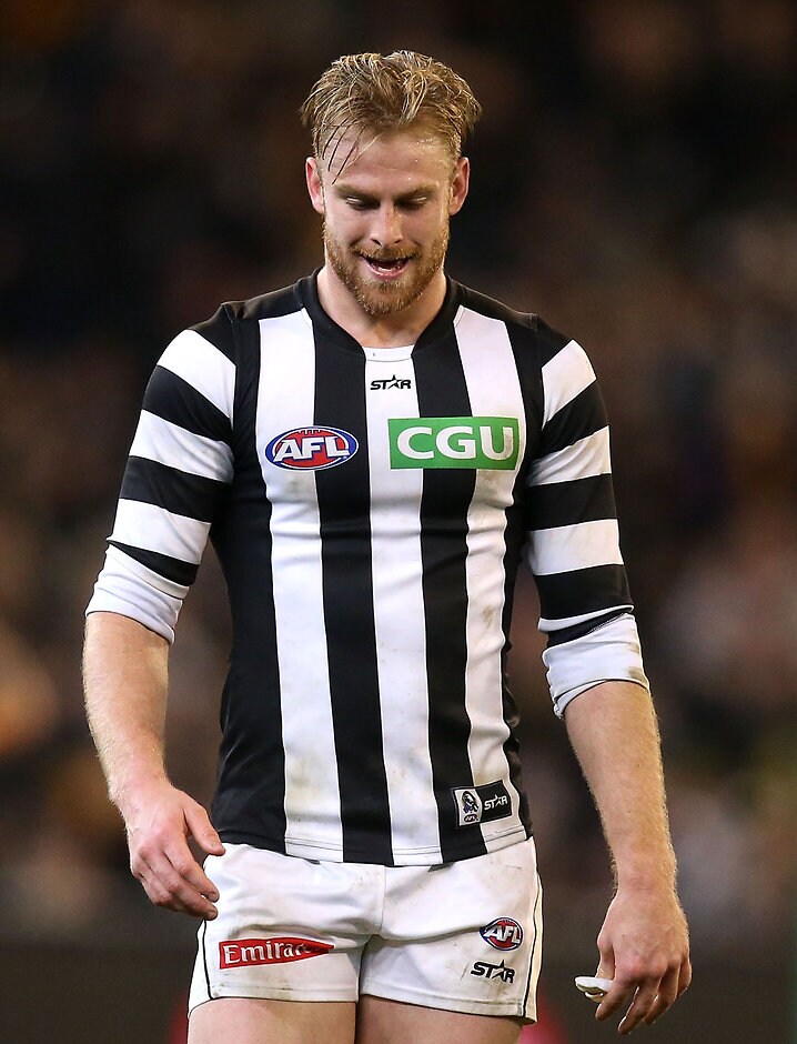AFL 2016 Rd 20 - Richmond v Collingwood MELBOURNE, AUSTRALIA - AUGUST 05: Jonathon Marsh of the Magpies looks dejected during the 2016 AFL Round 20 match between the Richmond Tigers and the Collingwood Magpies at the Melbourne Cricket Ground on August 05, 2016 in Melbourne, Australia. (Photo by Justine Walker/AFL Media)